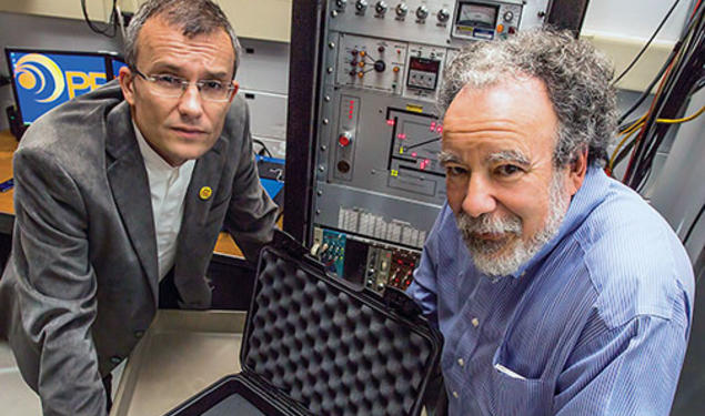 Alexander Glaser, left, and Robert Goldston with a stand-in for a warhead that will be used to test their system for verifying the presence of nuclear warheads.