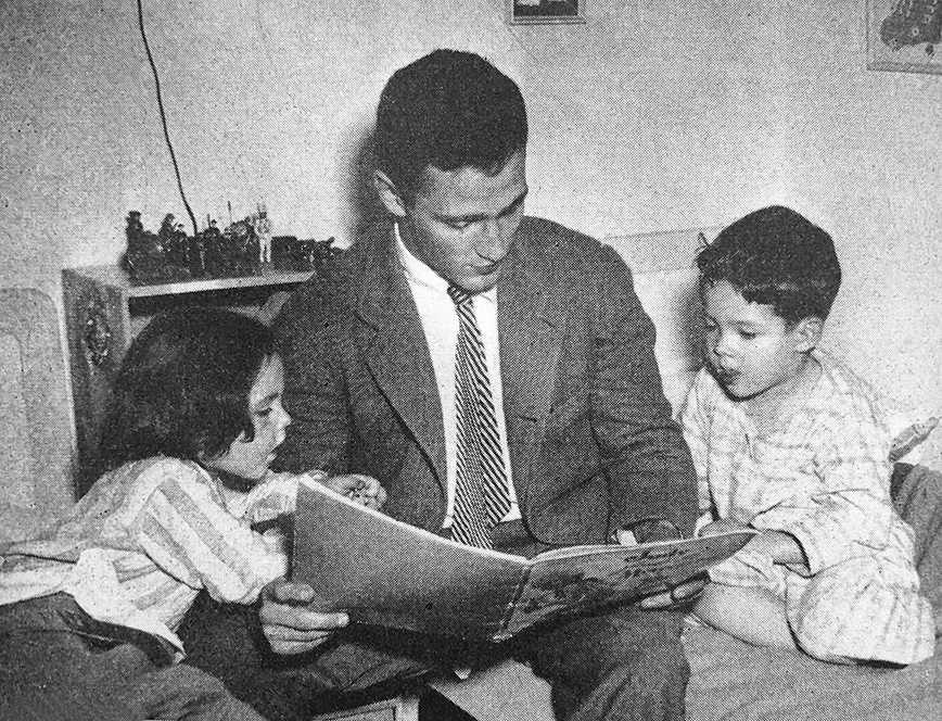 Princeton student reading to two young children
