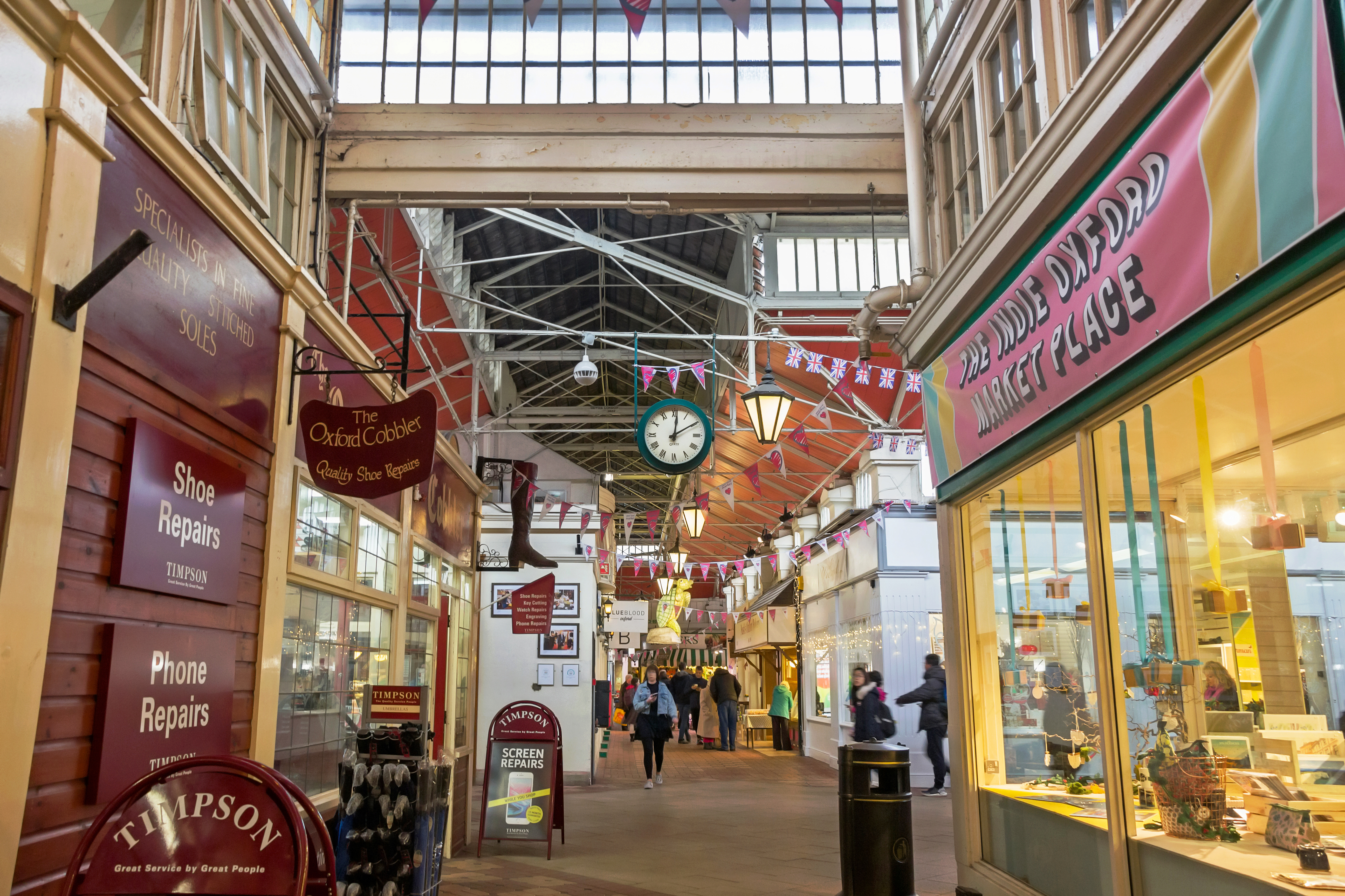 A view of several stores inside of the Covered Market