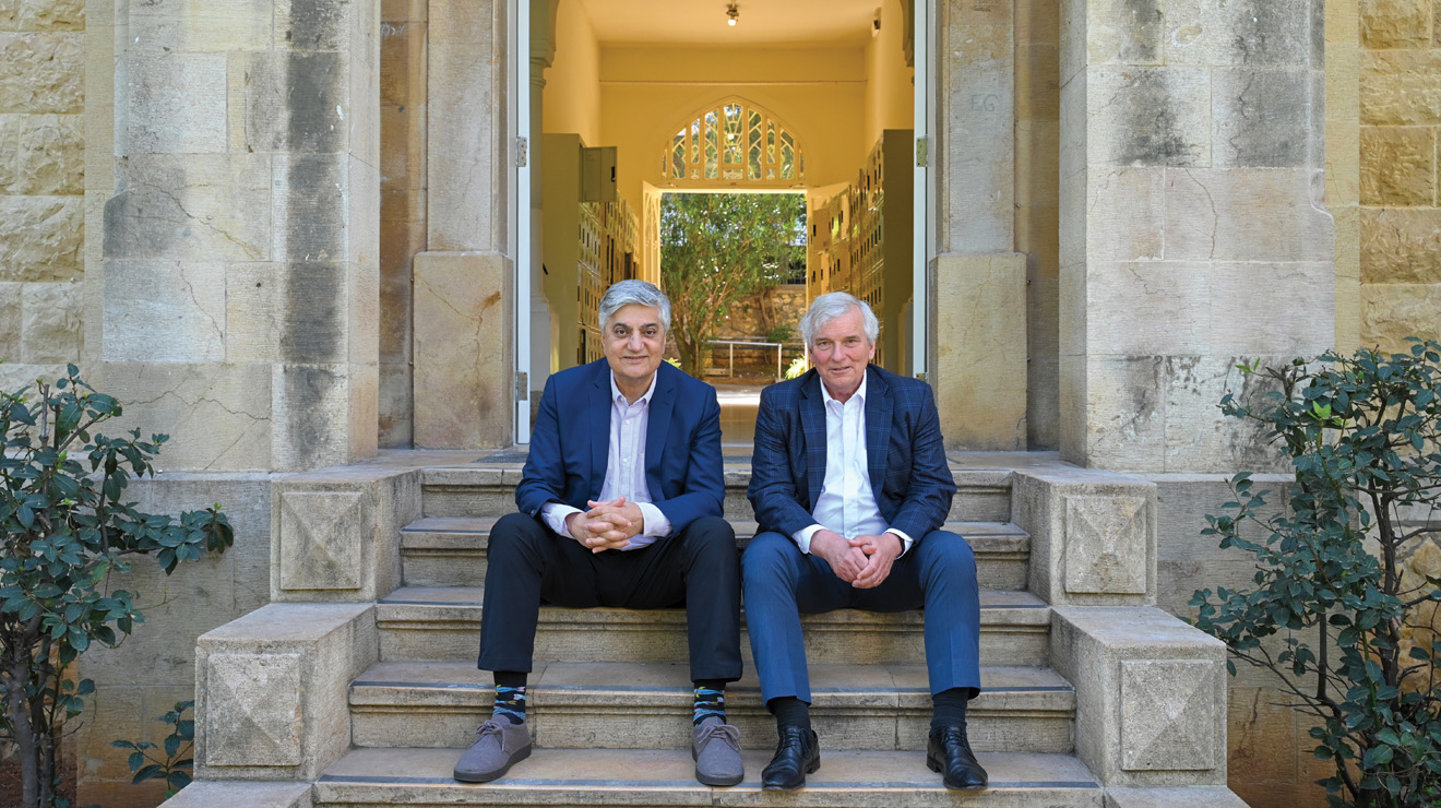 University president Chaouki Abdallah, left, and Philip Stoltzfus &rsquo;79 on the steps of Sage Hall at Lebanese American University before the latest round of fighting.