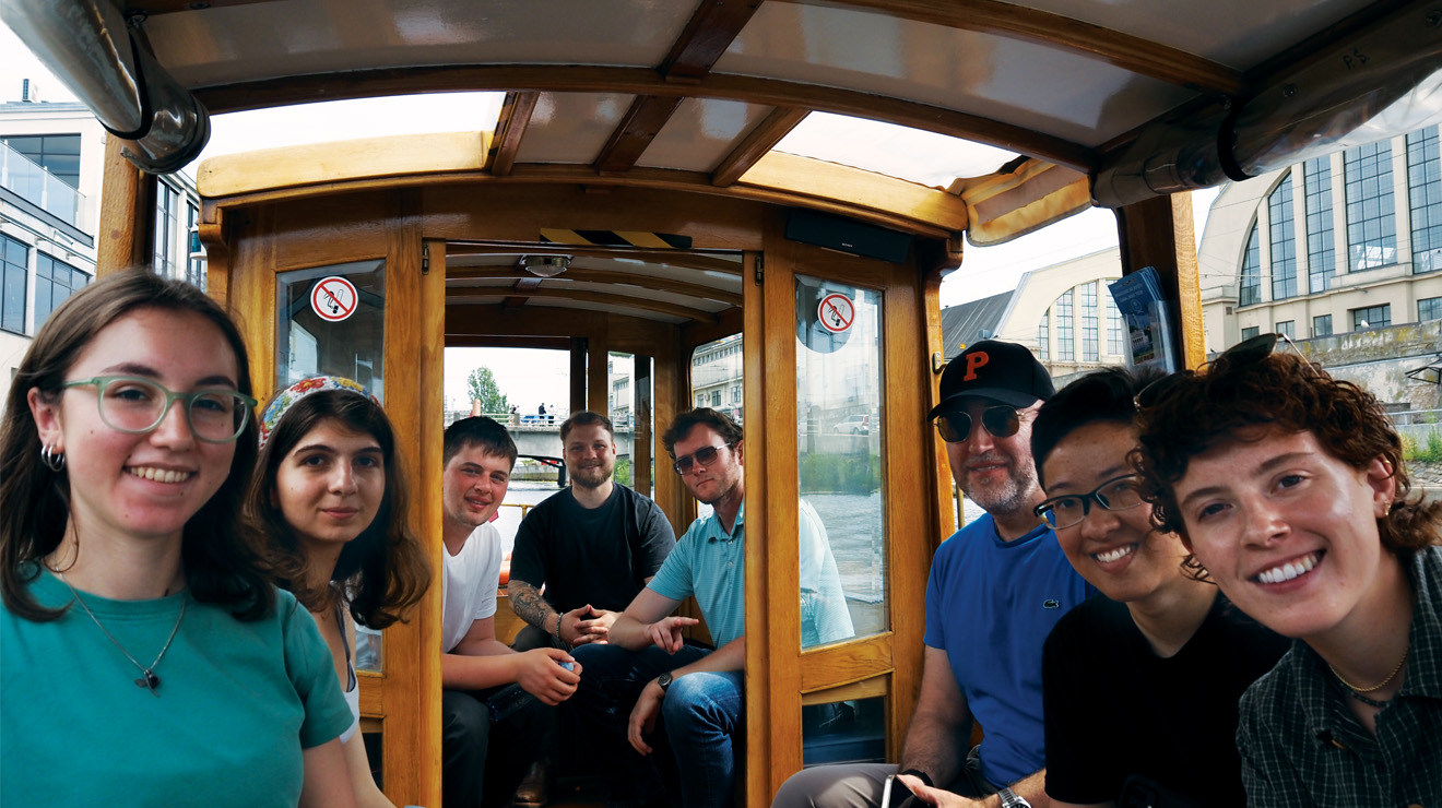 The summer program tours Riga, Latvia, by boat.
