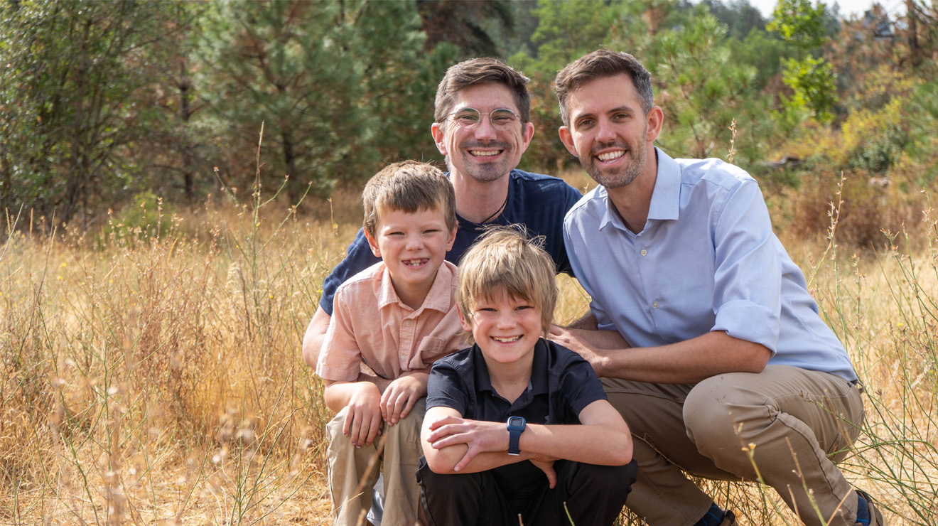 Zack Zappone *19, right, in a portrait with his husband and two sons.