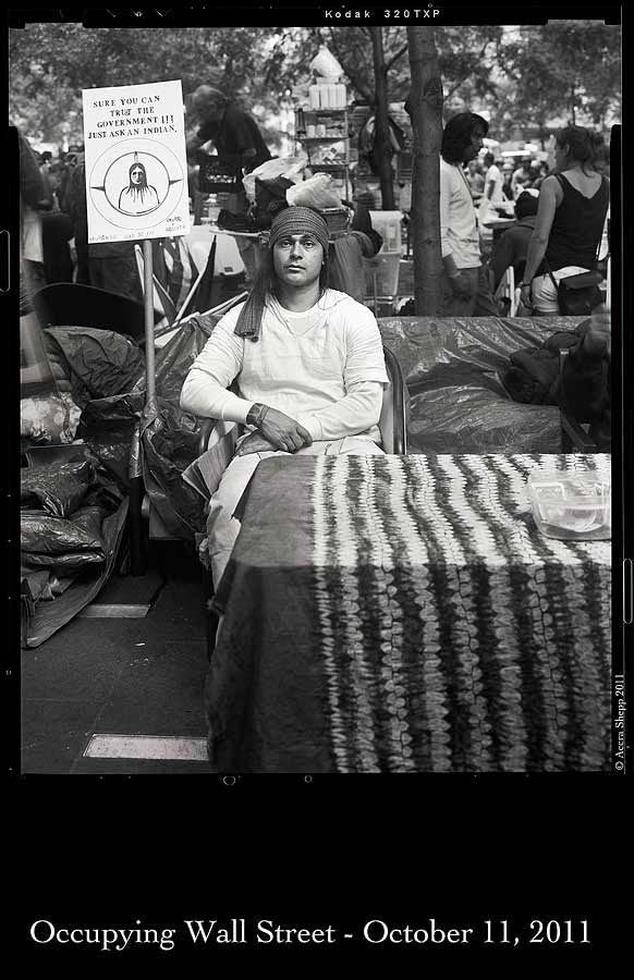 0025ows_indian_edit01.jpg A Native American protester. His sign reads "Sure you can trust the government!!! Just ask an Indian." (Photos © Accra Shepp '84)
