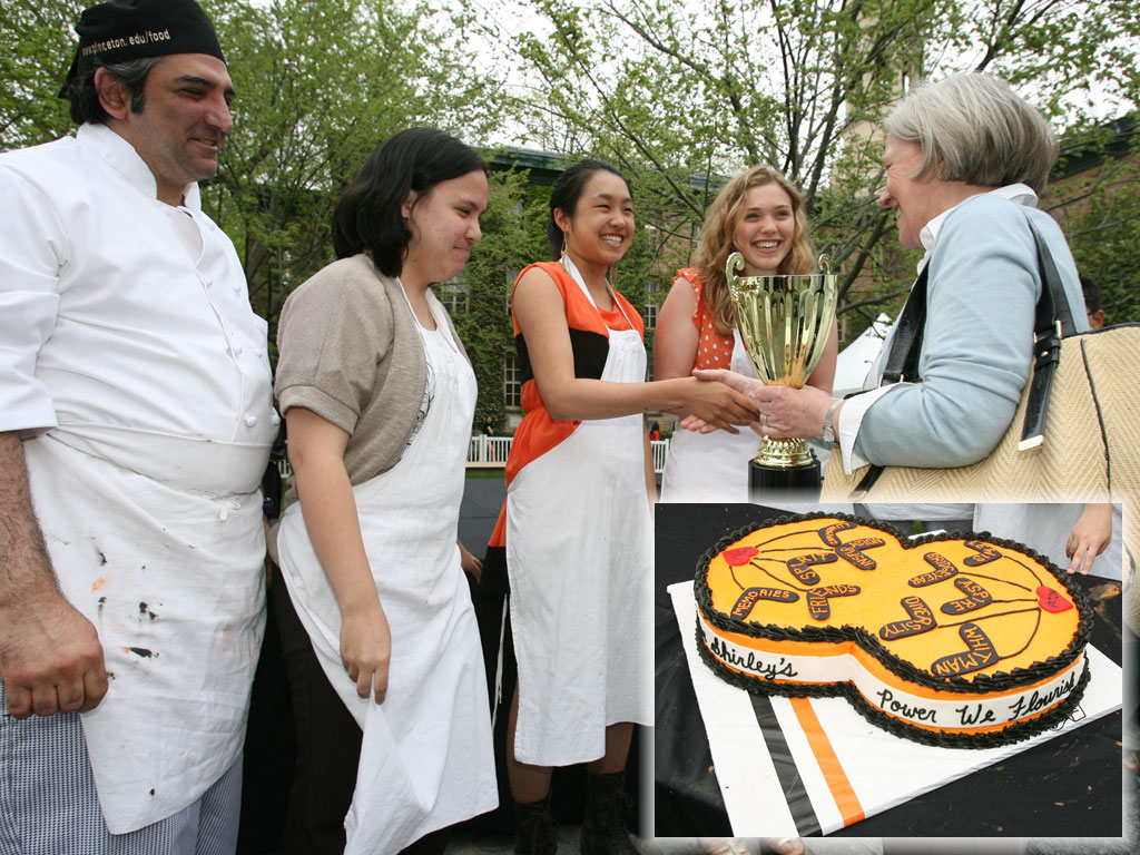 President Tilghman congratulates the winners of the "Iron Tiger" cake contest. Their design, inset, featured the motto "Under Shirley's power we flourish."