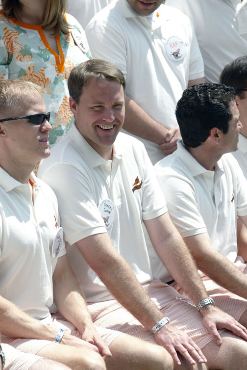 Geremy Connor ’99 and classmates sit for a photo.