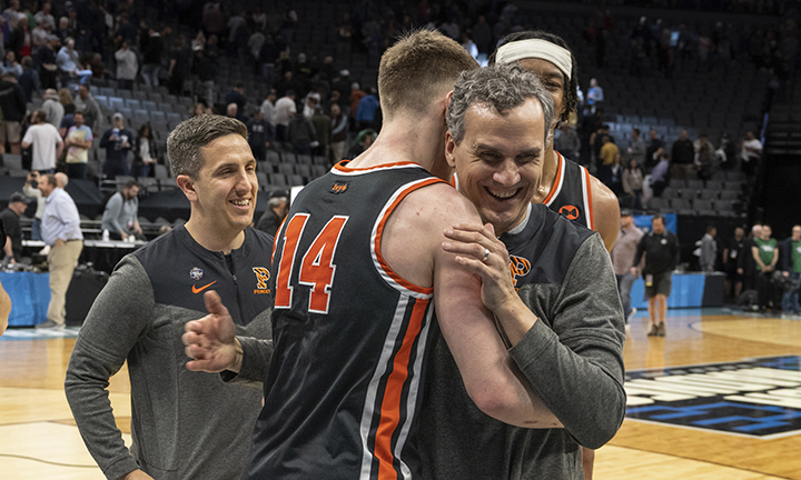 Princeton head coach Mitch Henderson ’98 embraces guard Matt Allocco ’23 after the win over Arizona