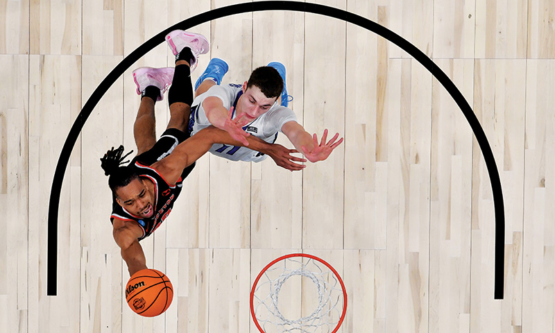 Tosan Evbuomwan &rsquo;23 on the court with Creighton&rsquo;s Ryan Kalkbrenner.
