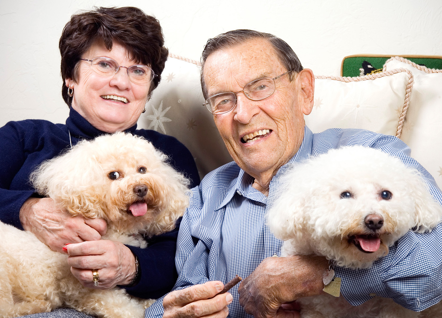 Cheri Cross-Bushnell, holding Abby, and Ace Bushnell, holding Colette, at their home in Tucson, Ariz.