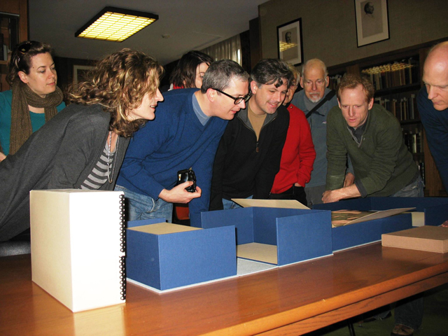 The cast of 'Gatz' examines the final manuscript of The Great Gatsby at Firestone Library Dec. 16.