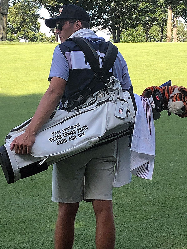 Fretty’s caddie, teammate Henry Dubiel ’24, carried a Princeton golf bag that reads, "First Lieutenant Victor Edward Prato 82nd ABN DIV." A plush tiger covers one of the golf clubs.