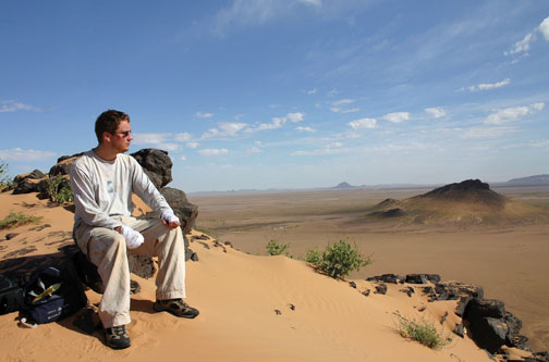 Iain Couzin in Mauritania, where he was studying locusts. His hands are bandged because a toxin from the locusts got on his skin and reacted to sunlight, causing pain.
