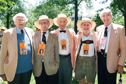 1944&rsquo;s theme, honoring classmates who served in World War II, struck a chord with spectators. Here, classmates Andy McIntosh, Bill Zinsser, Burnham Carter, Lew Doom, and Sandy McDonnell wear dog tags with their Freshman Herald photos.