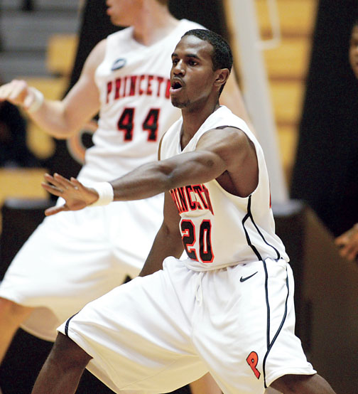 High-scoring guard Douglas Davis ’12, center, has improved as a defender.