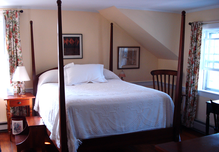 The poster bed is from an eBay seller in Philadelphia. The curtains are from an eBay seamstress in Oregon. Lefevre chose the fabrics online. The whale oil bedside lamp (converted to electric) is from a seller in Rhode Island. And the vintage Chenille Hobn