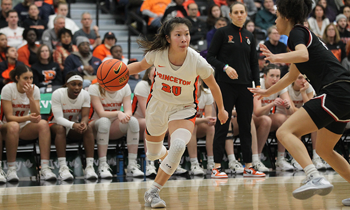 A Princeton women's player dribbles past an opposing player.