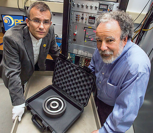 Alexander Glaser, left, and Robert Goldston with a stand-in for a warhead that will be used to test their system for verifying the presence of nuclear warheads.