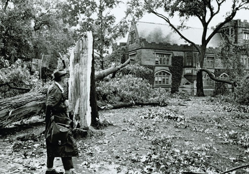 NB_DigiLibrary0254.jpg An onlooker assesses damage outside East Pyne after a storm in the 1950s