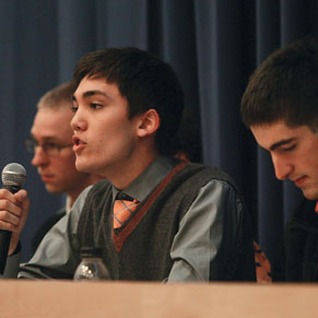 NB_OWS034new.jpg Christian Fong ’14 critiques Occupy Wall Street during a Jan. 13 debate. Listening are Kevin Henneck ’13, left, of the anti-Occupy side and Peter Favaloro ’12, right, of the pro-Occupy team.