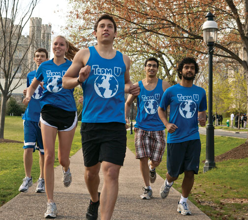 Joe Benun ’15, center, trains with members of Team U before a half-marathon April 22 to benefit Shoe4Africa.