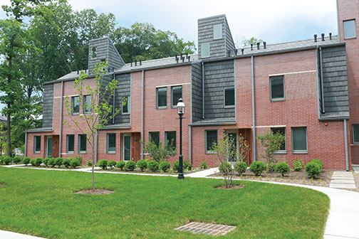 Lakeside’s townhouses feature brick and tile exteriors and landscaping.