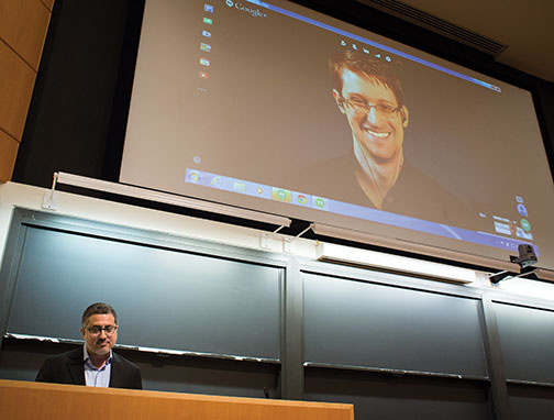 Journalist Bart Gellman ’82, left, talks with Edward Snowden via video link.