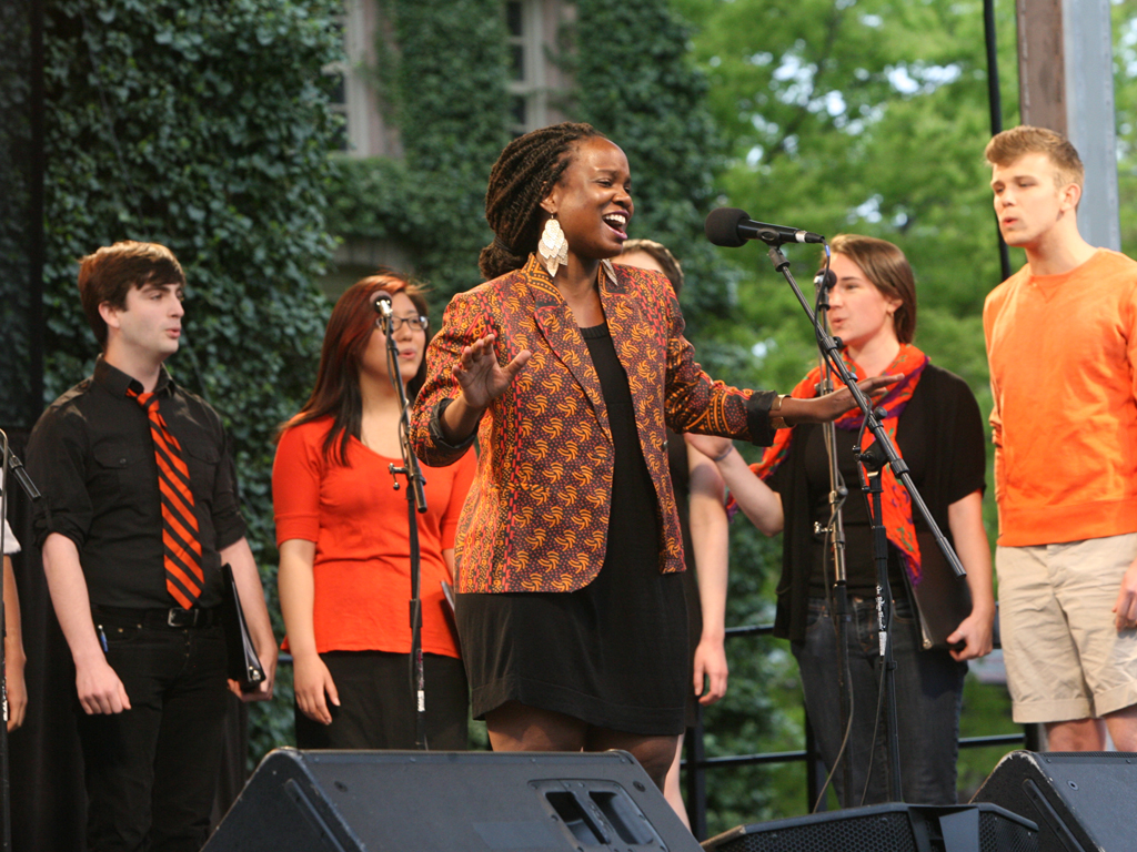 Tanyaradzwa Tawengwa '14, center, leads a performance by an a cappella group composed of members from each campus ensemble.