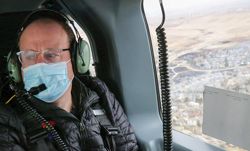 Polis flies over his hometown of Boulder 