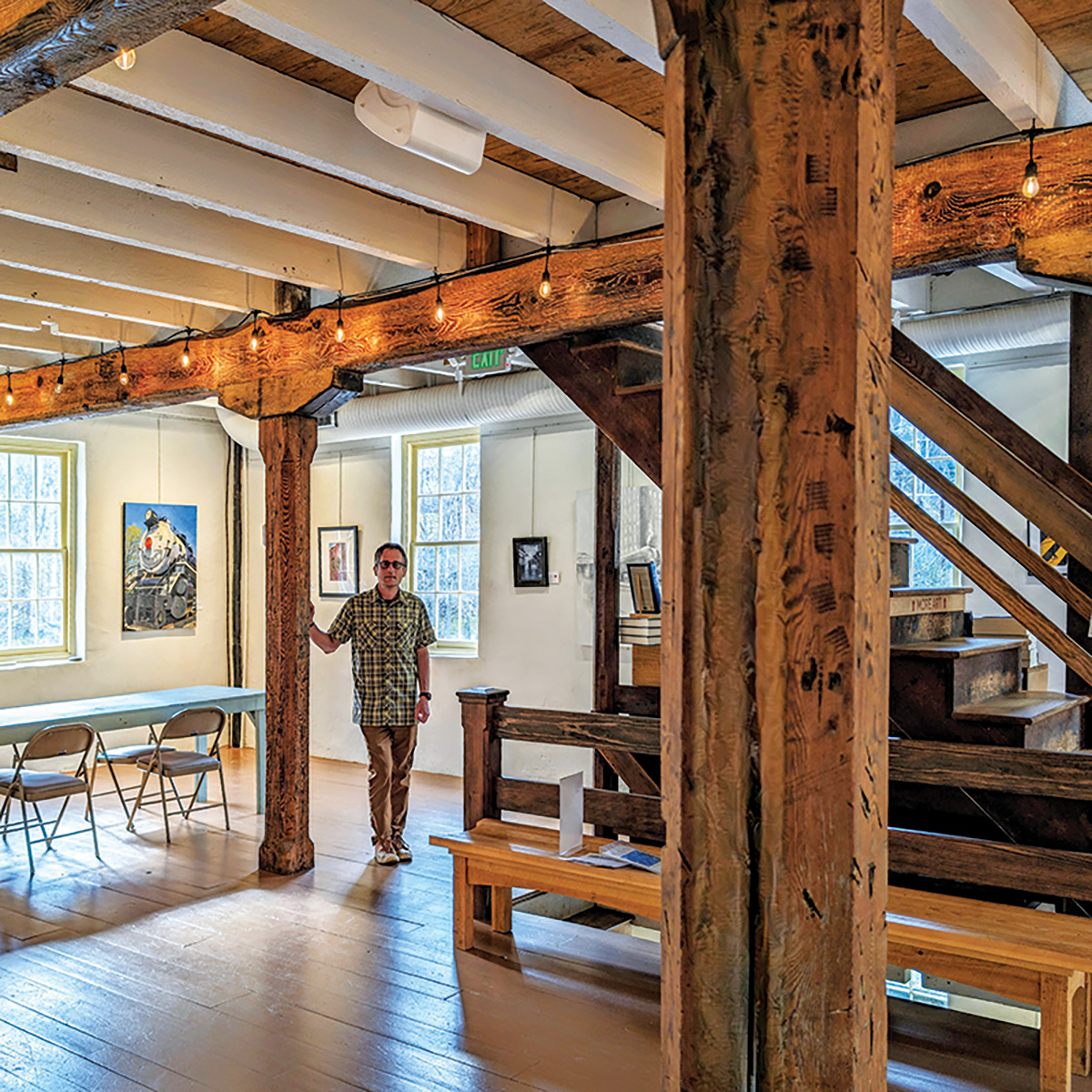 Angelo Otterbein ’95 inside Manor Mill, left, and what it looked like before the renovations were underway, above.