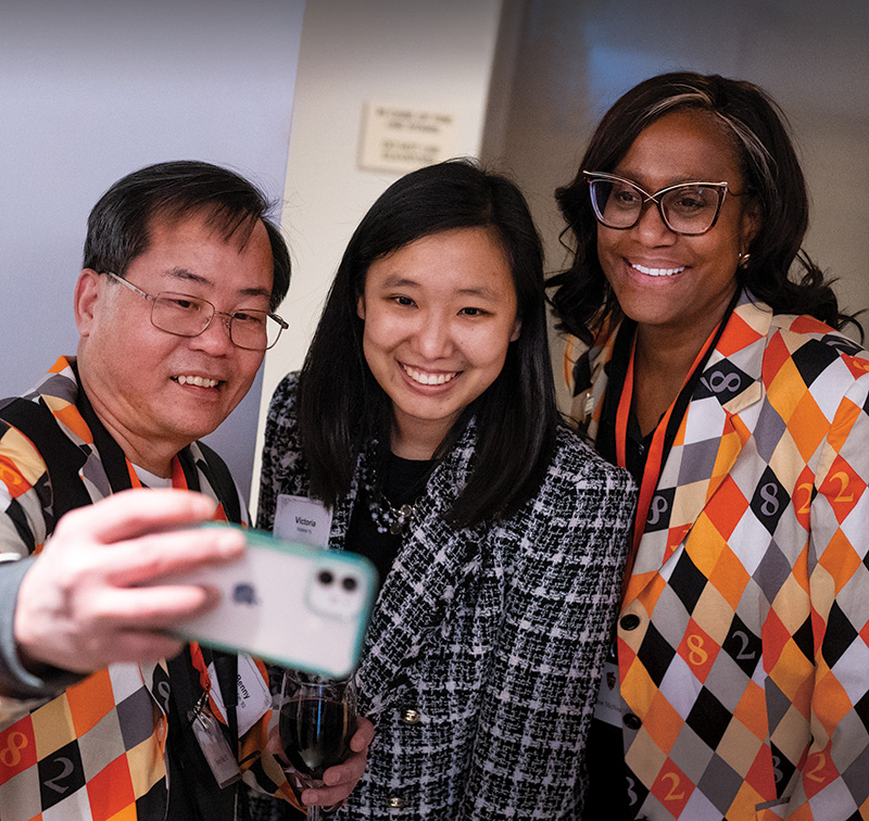 Three Alumni posing for selfie
