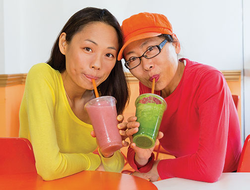 Yuchen Zhang ’10, left, and her mother, Tanyue Chen, run a smoothie shop in downtown Santa Monica.