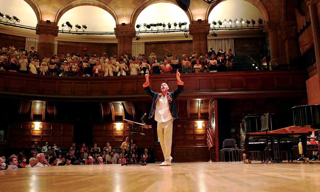 Gabriel Crouch leads the Glee Club Reunion Sing &mdash; &ldquo;Spem in Alium,&rdquo; in Alexander Hall.
