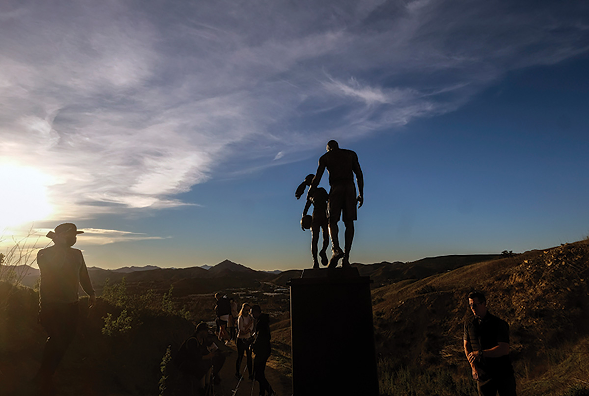 Former NBA player Kobe Bryant, his daughter Gianna Bryant, and seven other people are remembered with a bronze statue at the site of the helicopter crash in Calabasas, California, where they died in 2020.