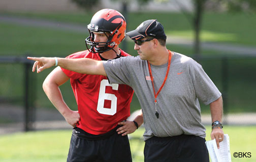Kedric Bostic ’16, left, is one of three quarterbacks that football coach Bob Surace ’90, right, says have star potential. 