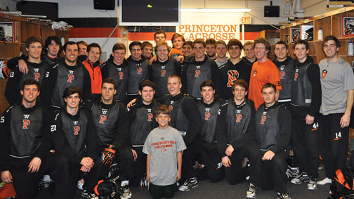 SP_mlaxteamNew.jpg The lacrosse team with coach Chris Bates’ son, Nicholas, whose mother died of cancer last year.