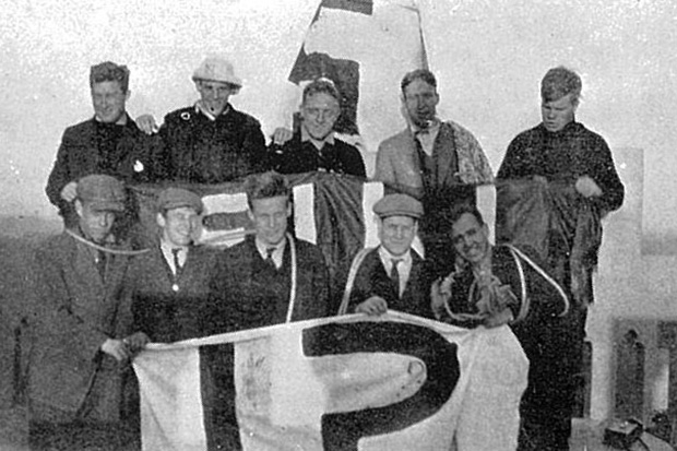 More interclass hijinks: 1914 sophomores with a group of 1915 freshmen who tried to raise their class numerals over Holder Hall.