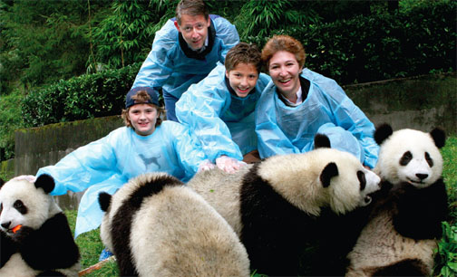 Dean Slaughter, Professor Moravcsik, and their children, Edward (left) and Alexander, at the Wolong Panda Reserve—the largest in China.