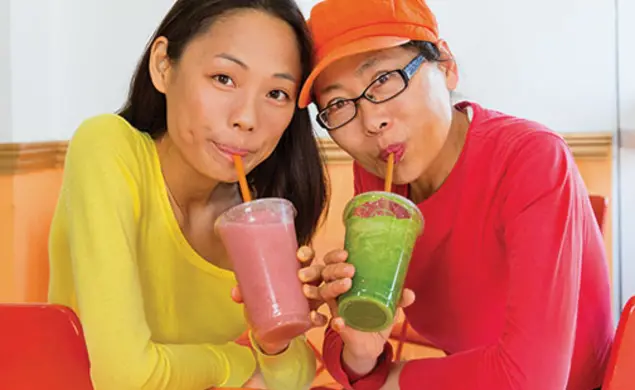 Yuchen Zhang ’10, left, and her mother, Tanyue Chen, run a smoothie shop in downtown Santa Monica.
