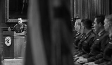 In this black and white photo, Gen. Mark Milley speaks at a podium on the left bearing the Princeton seal, while young men in military uniforms watch him from the right. 