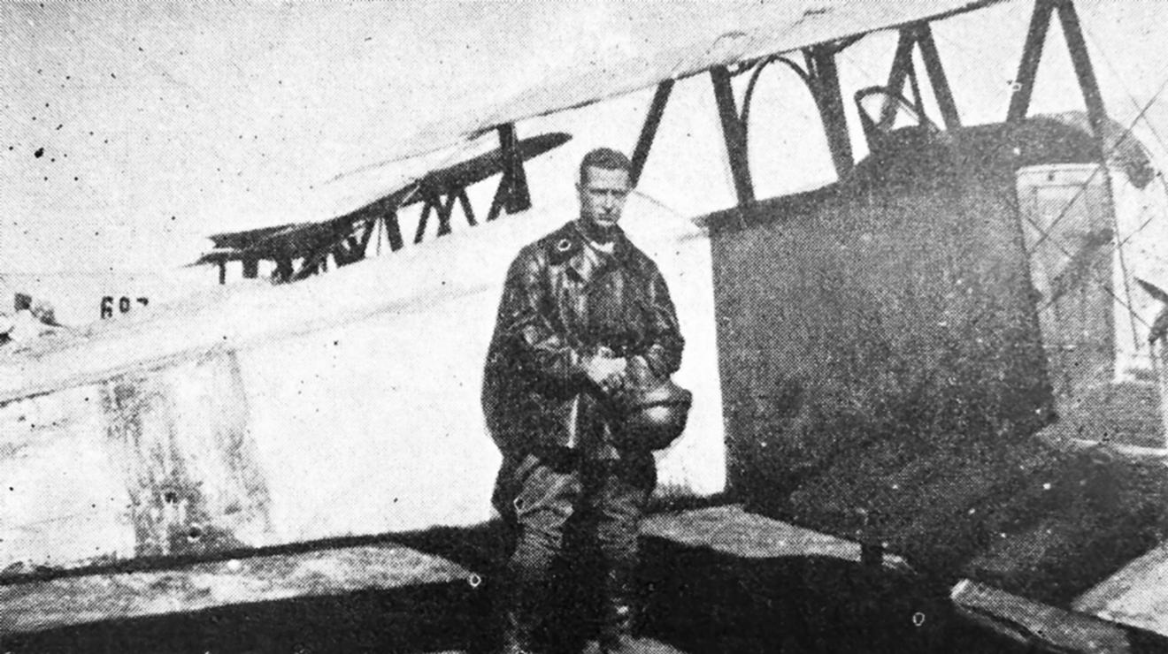 Hobey Baker as a Flight Commander in France stands by his plane. 