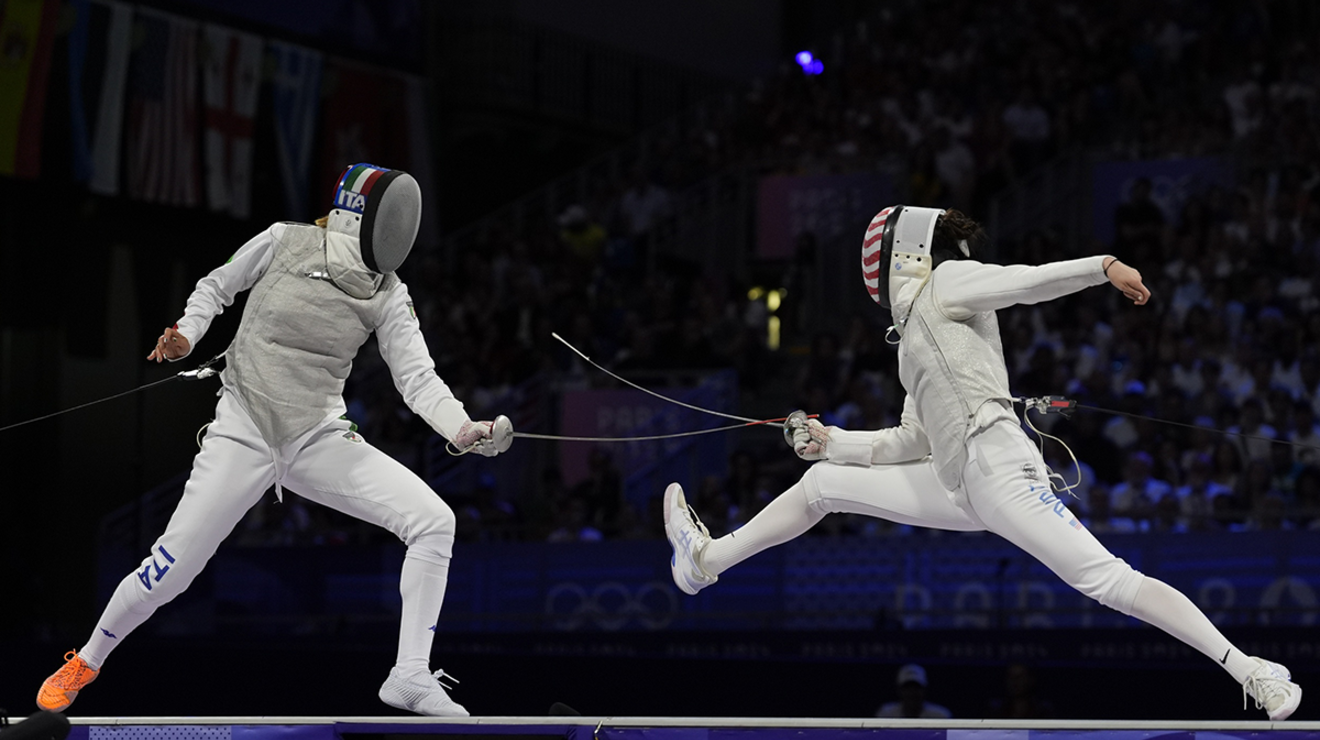 Maia Weintraub ’25, right, lunges toward Italy’s Arianna Errigo in the women’s team foil gold medal match.