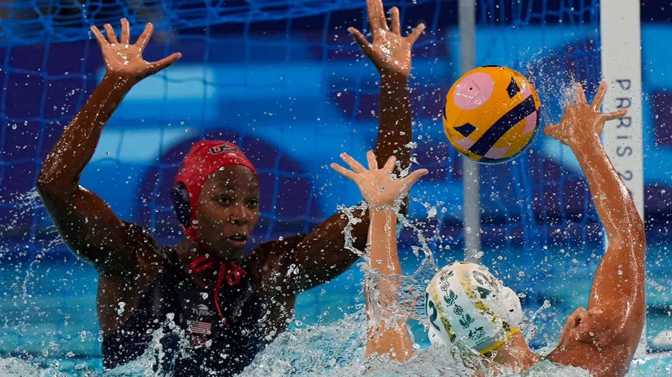Ashleigh Johnson ’17, left, defends a shot by Australia’s Danijela Jackovich in the Olympic semifinals.