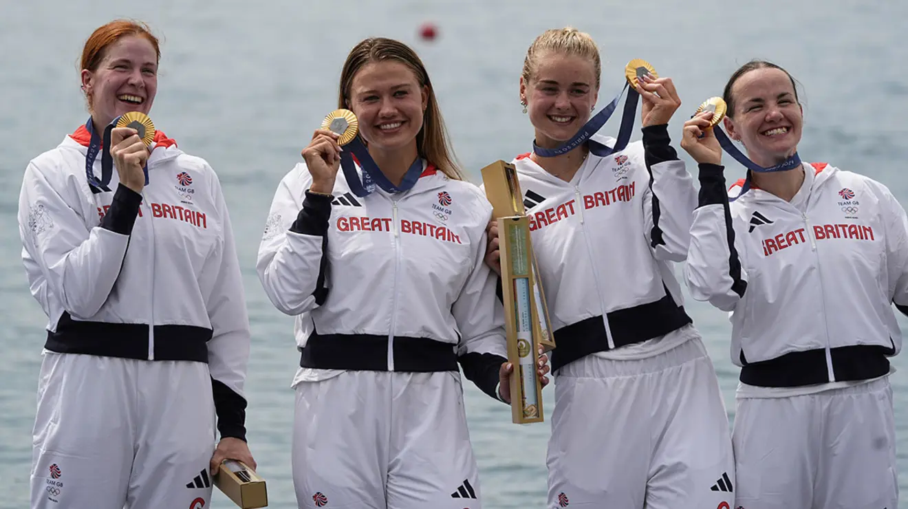 Hannah Scott ’21, second from right, celebrates with teammates Lauren Henry, Lola Anderson, and Georgina Brayshaw after winning gold in the women’s quadruple sculls.