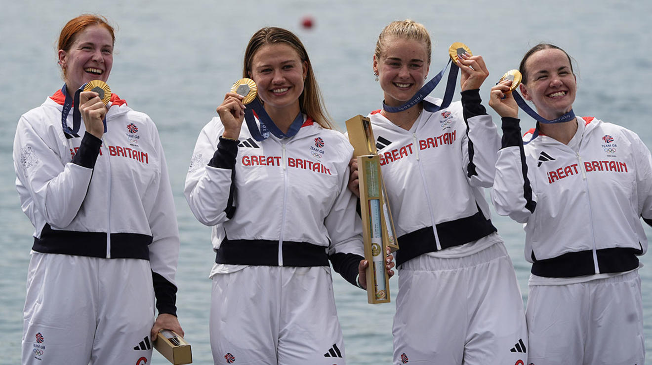 Hannah Scott ’21, second from right, celebrates with teammates Lauren Henry, Lola Anderson, and Georgina Brayshaw after winning gold in the women’s quadruple sculls.