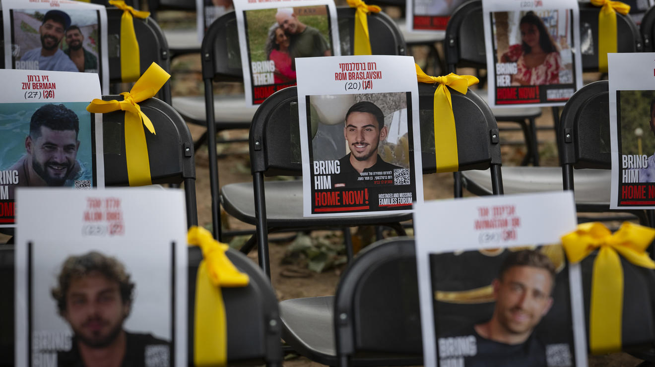 Flyers and ribbons are placed on chairs on the Frist North Lawn where attendees prayed for the 101 remaining hostages in Gaza