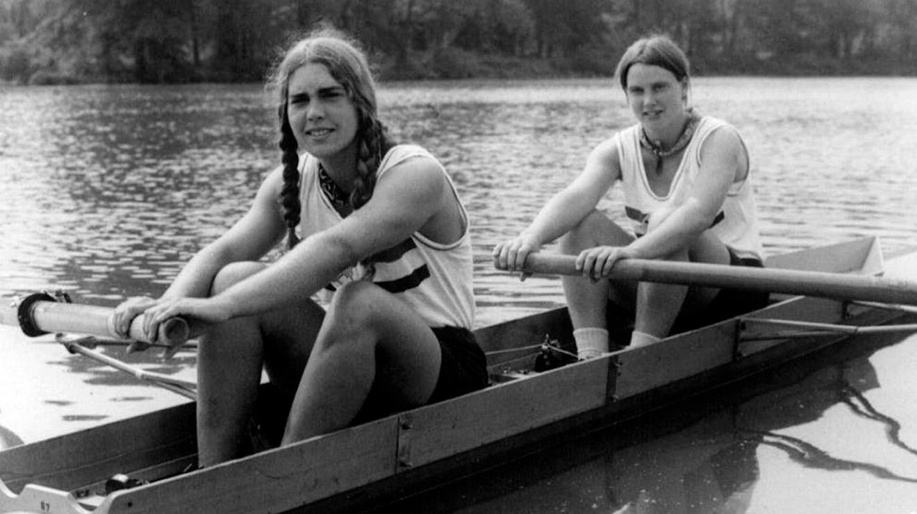 Carol Brown ’75 in black and white photo in boat on Lake Carnegie