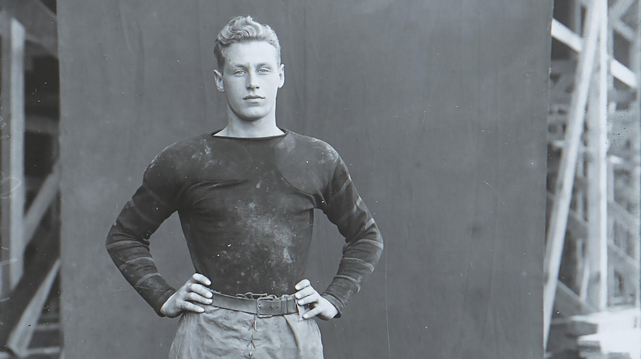 Hobey Baker 1914 in football uniform stands for a portrait