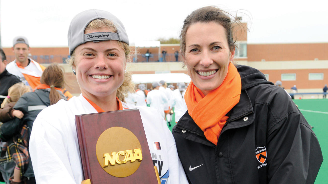 Kat Sharkey ’13 poses with NCAA Trophy