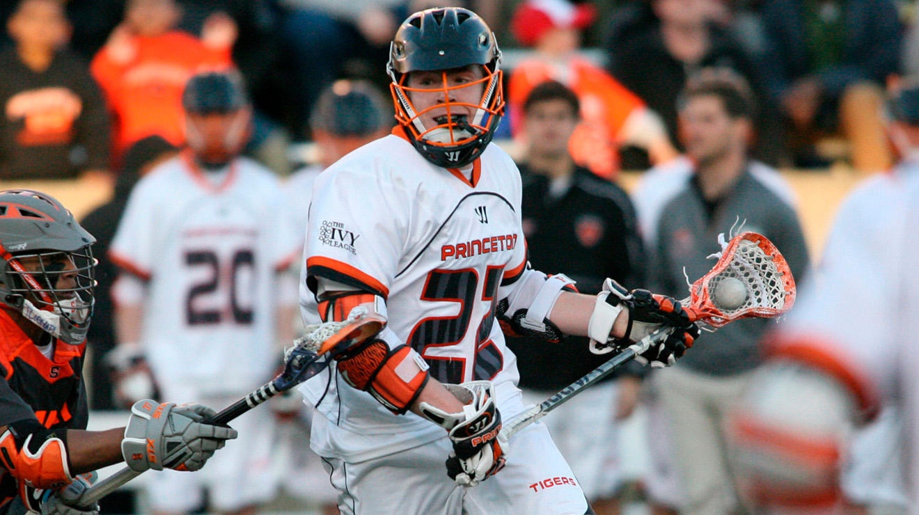 Tom Schreiber ’14 moves the ball down the field during a game