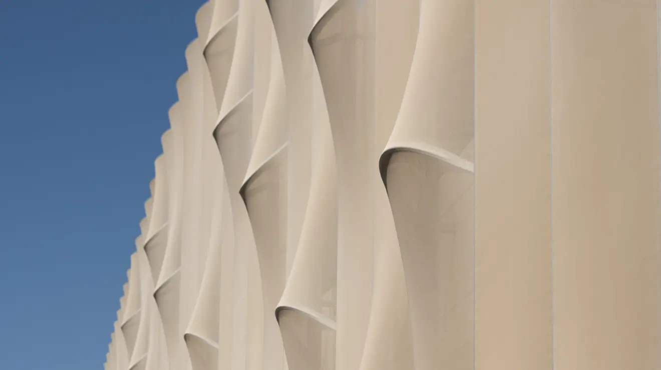 The screen wrap that encompasses the parking garage at the Meadows Neighborhood