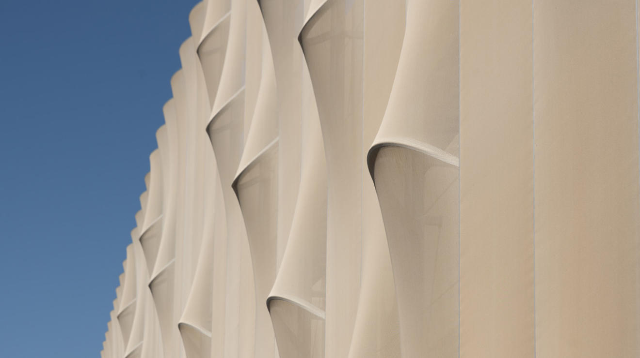 The screen wrap that encompasses the parking garage at the Meadows Neighborhood